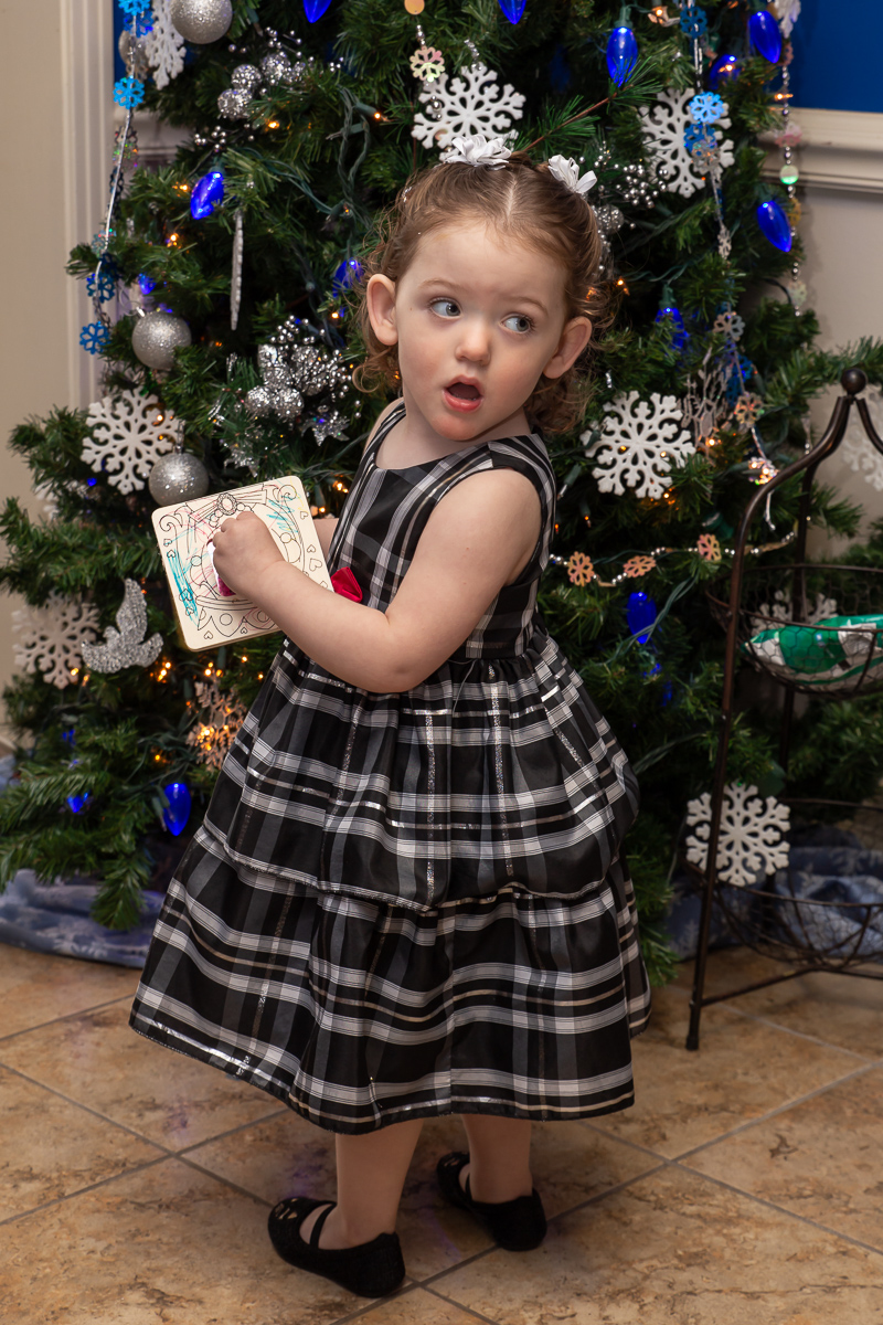 Toddler looking over her shoulder.