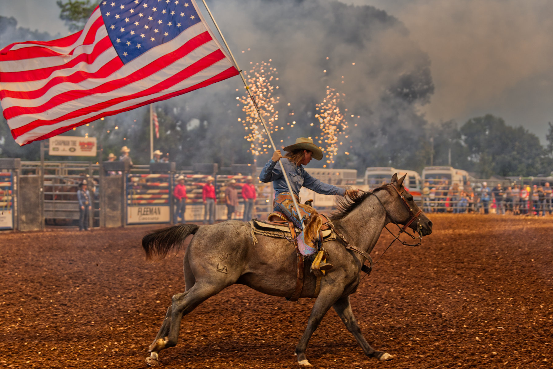 A horse and its rider with fireworks.