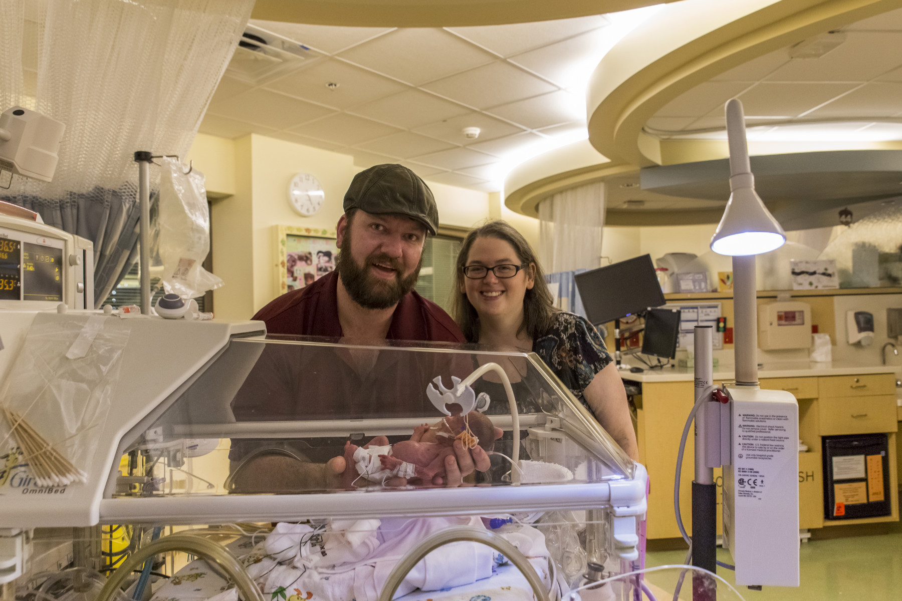 Mike and Tara with their first time holding Alana. Mike and Tara with their first time holding Alana.
