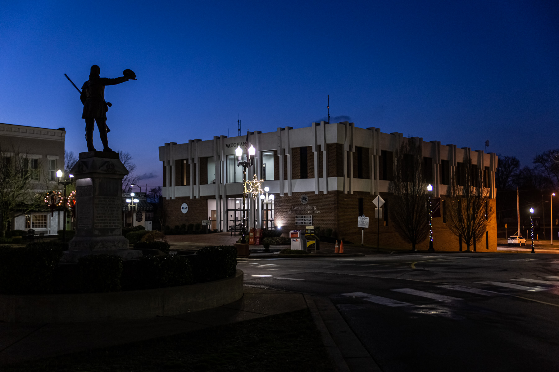 visit lawrenceburg tn tree down at xmas 6 David Crockett statue at night.